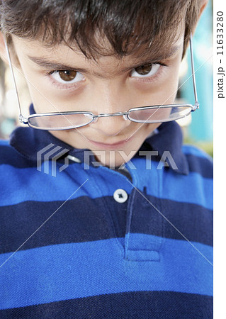 Hispanic boy wearing eyeglasses 11633280