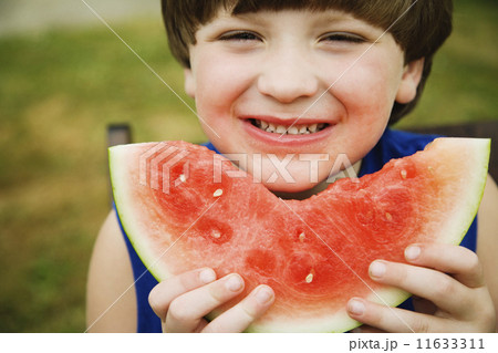 Boy eating watermelon 11633311