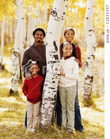 African family standing next to tree African family standing next to tree 11633347