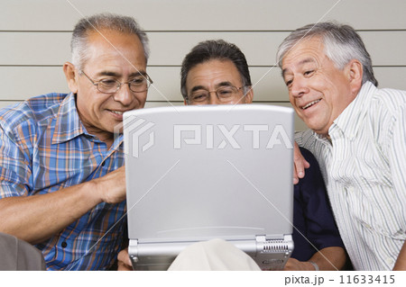 Three elderly men with laptop Three elderly men with laptop 11633415