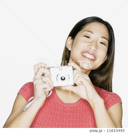 Asian woman holding camera Asian woman holding camera 11633493