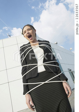 Businesswoman tied up and yelling 11633567