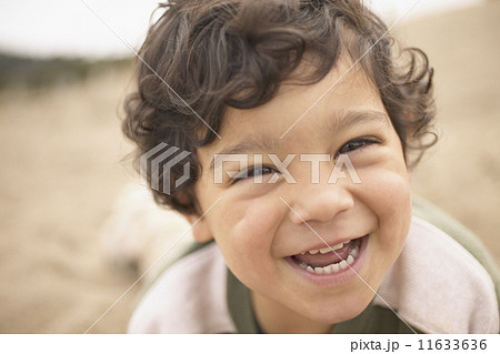 Close up portrait of boy laughing 11633636