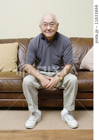 Portrait of elderly man sitting on couch Portrait of elderly man sitting on couch 11633666