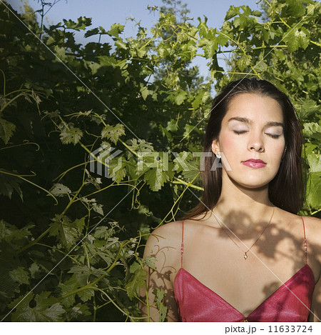 Hispanic woman with eyes closed 11633724