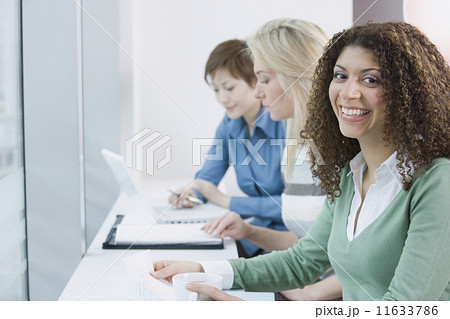 Multi-ethnic businesswomen at cafe Multi-ethnic businesswomen at cafe 11633786