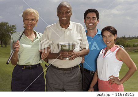 Multi-ethnic couples holding golf trophy 11633915