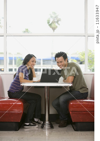 Asian couple looking at laptop 11633947