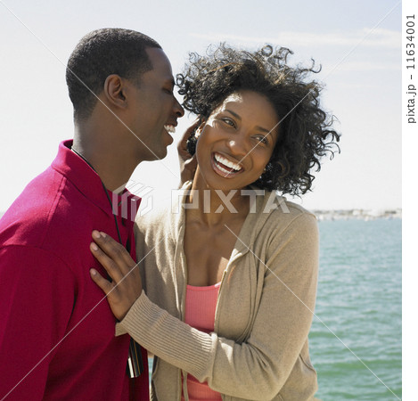 African couple hugging at beach African couple hugging at beach 11634001