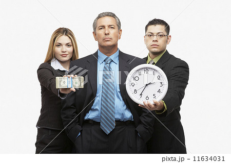 Hispanic businesspeople with clock and money 11634031
