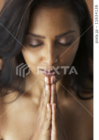 Asian woman meditating Asian woman meditating 11634136