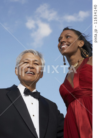 Low angle view of Mixed Race woman and senior man 11634140
