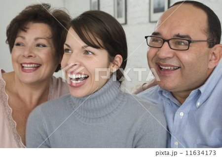 Portrait of Hispanic parents and adult daughter Portrait of Hispanic parents and adult daughter 11634173