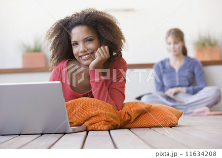 African woman next to laptop African woman next to laptop 11634208