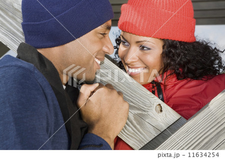 Multi-ethnic couple smiling at each other 11634254