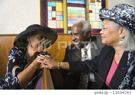 African American senior talking in church 11634261