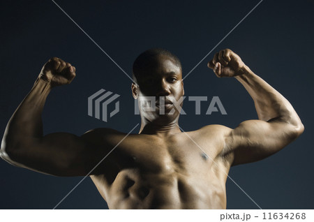 African American man flexing muscles 11634268