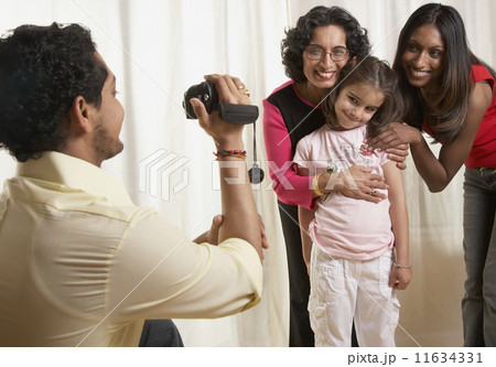 Indian father video recording family Indian father video recording family 11634331