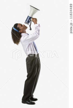 Full side view of businessman holding megaphone up 11634489