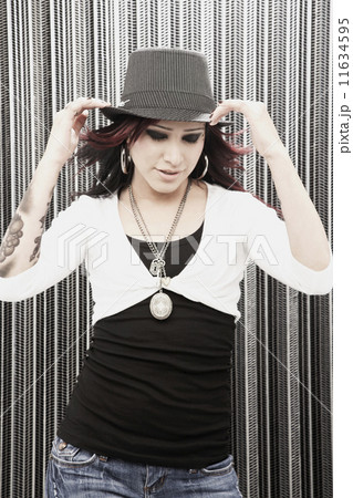 Young Hispanic woman wearing hat Young Hispanic woman wearing hat 11634595