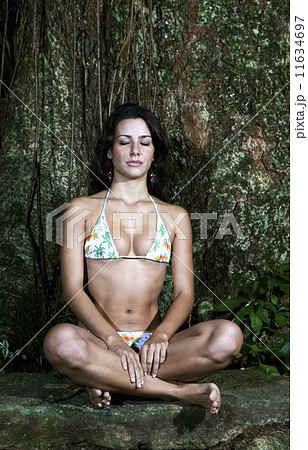 Hispanic women wearing bikinis in woods Hispanic women wearing bikinis in woods 11634697