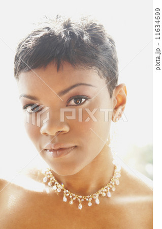 African American woman wearing diamond necklace African American woman wearing diamond necklace 11634699