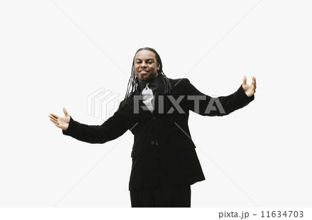 Portrait of African businessman with arms outstretched Portrait of African businessman with arms outstretched 11634703