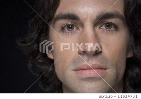 Close up of man with curly hair Close up of man with curly hair 11634731