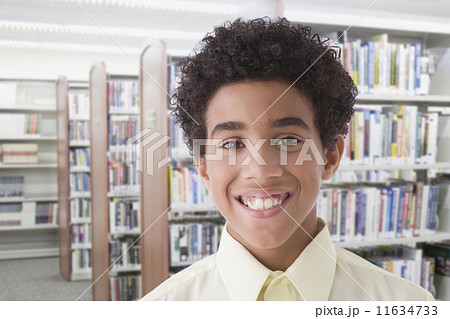 Hispanic boy in library 11634733