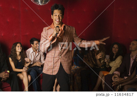 Mixed Race man singing karaoke at nightclub Mixed Race man singing karaoke at nightclub 11634817