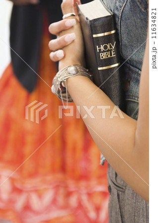 African woman holding bible African woman holding bible 11634821