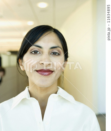 Close up of Indian businesswoman smiling Close up of Indian businesswoman smiling 11634895