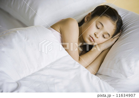 Asian girl sleeping in bed 11634907