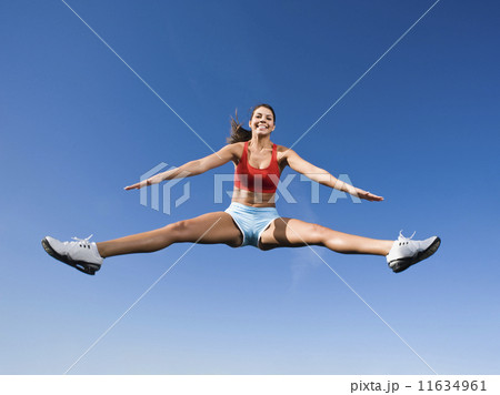 Native American woman jumping in mid-air 11634961