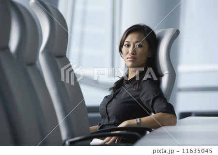 Asian businesswoman sitting in conference room 11635045