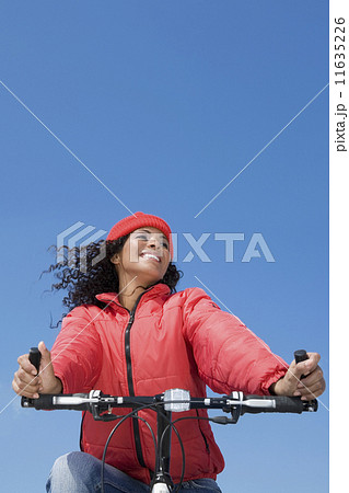 Hispanic woman riding bicycle 11635226