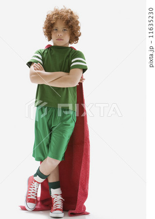 Mixed Race boy wearing towel as cape 11635230