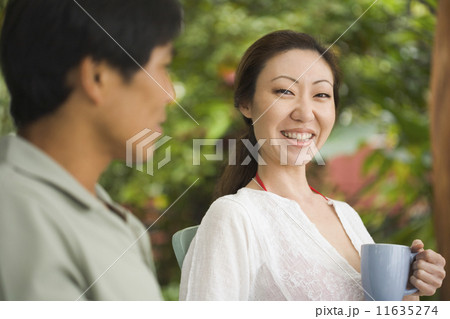Asian woman drinking coffee 11635274