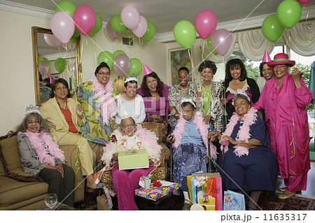 Group portrait of senior adult birthday party with balloons 11635317