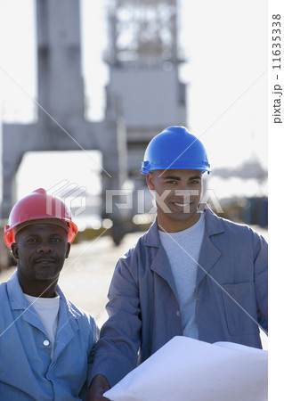 African American male construction workers with blueprints African American male construction workers with blueprints 11635338
