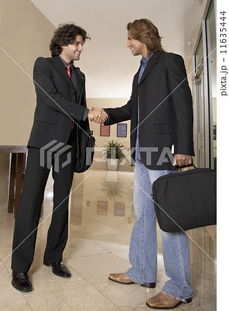 Two businessmen shaking hands Two businessmen shaking hands 11635444