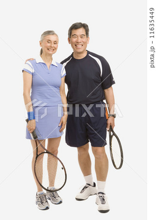 Senior couple holding tennis rackets 11635449