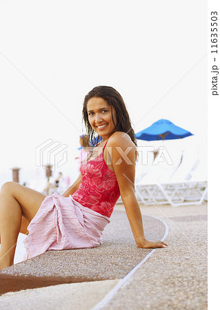 Hispanic woman wearing bathing suit 11635503