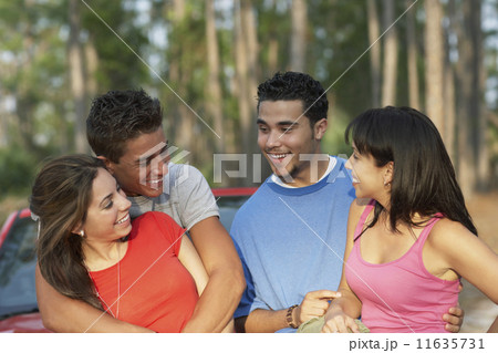 Two young couples hugging 11635731