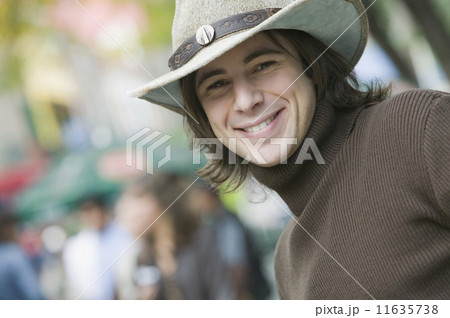 Hispanic man wearing cowboy hat 11635738