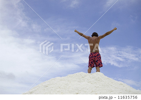 Hispanic man with arms raised 11635756