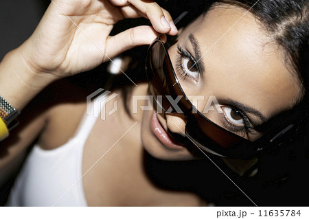 Hispanic woman wearing sunglasses Hispanic woman wearing sunglasses 11635784