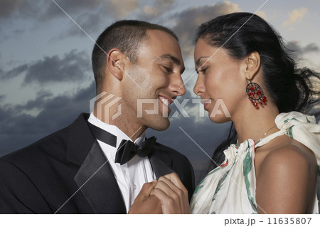 Hispanic couple smiling at each other 11635807