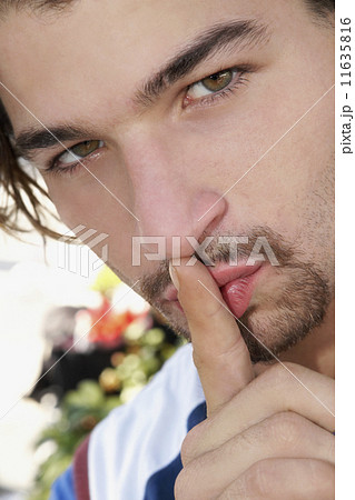 Hispanic man shushing Hispanic man shushing 11635816