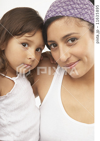 Mother and daughter smiling for the camera Mother and daughter smiling for the camera 11635895